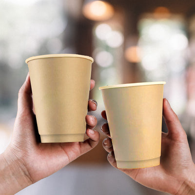 Two hands holding two 8oz Disposable Coffee Cups made from Bagasse.