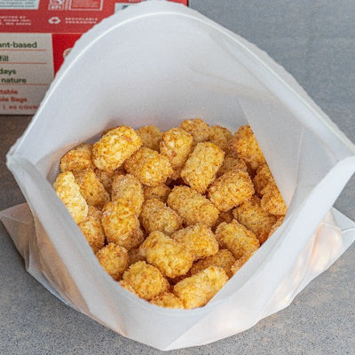 Tater Tots Kept Inside Compostable Gallon Resealable Bags of 11.5 X 10.6.