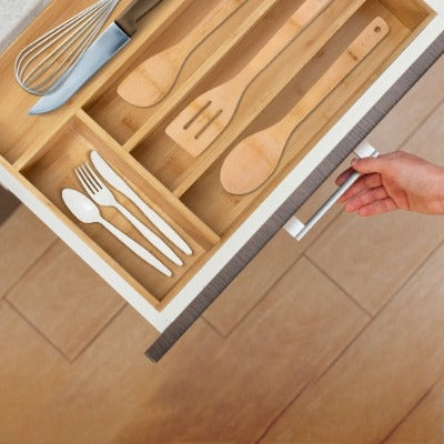 Eco Friendly Cutlery sets placed on a bamboo kitchen drawer organizer 
