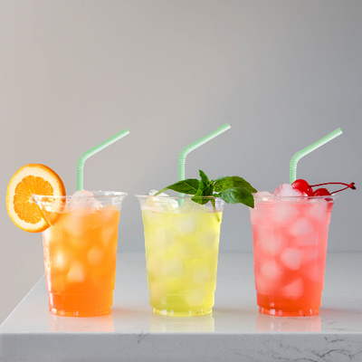 Three colorful drinks in glasses with Compostable Bendable straws